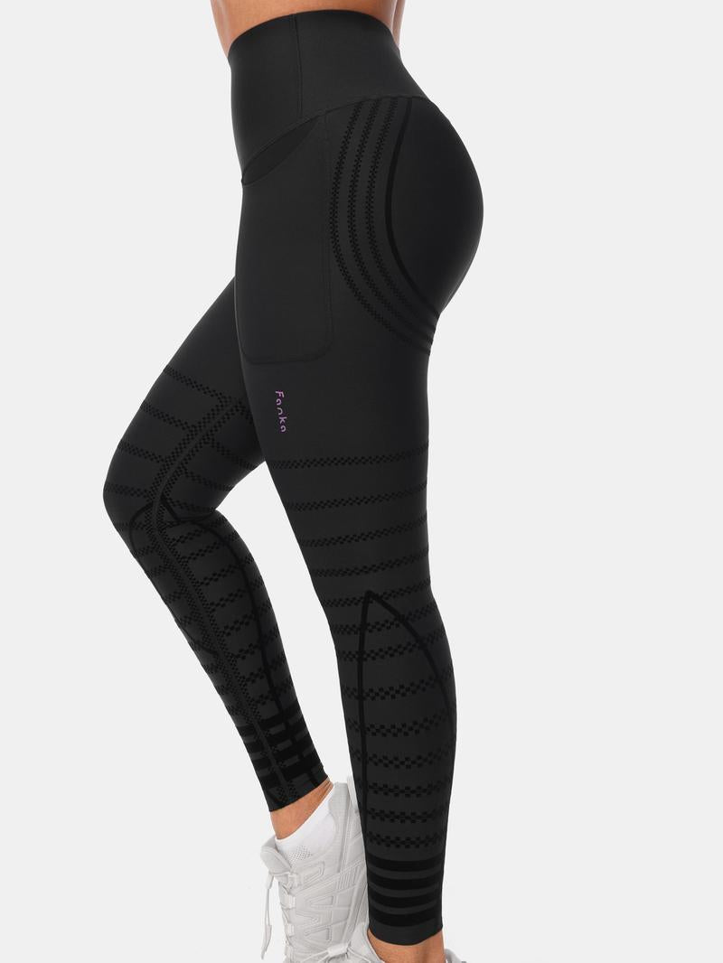 Black high-rise recovery leggings showing the waistband and patterned leg panels